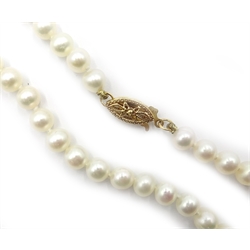  Single strand pearl necklace the gold clasp, stamped 14K   