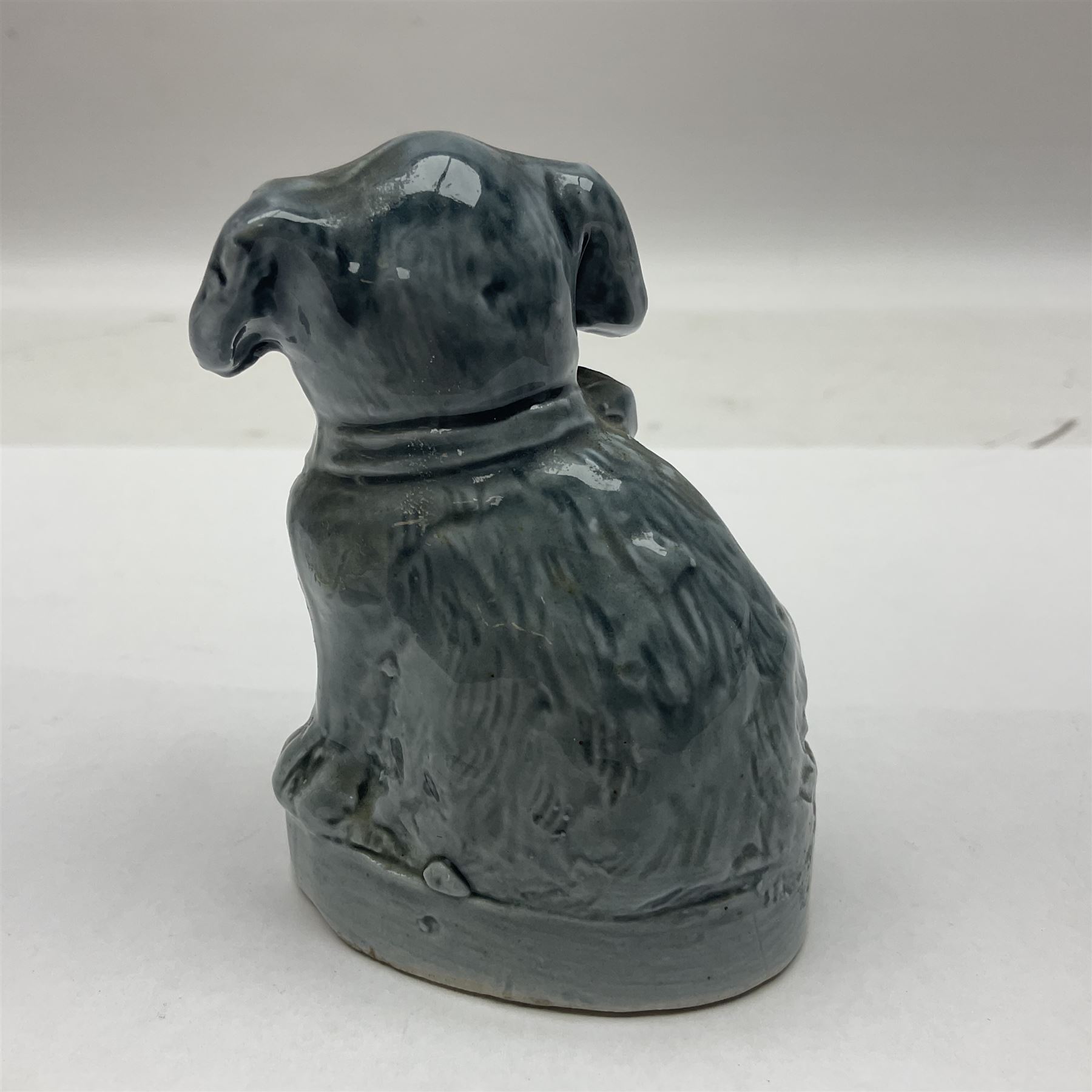 Suffragette blue glazed moulded ceramic dog, inscribed Votes For Women, H9cm
