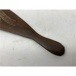 Australian aboriginal woomera spear thrower incised/carved with a wavy line and dots L69cm; and two boomerangs, one with carved geometric decoration (3)