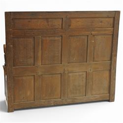 Victorian Jacobean Revival carved oak settle or hall bench with box seat, the cresting rail carved with repeating lunette motifs with acanthus and rosette decoration, over four back panels and hinged box seat, the panelled base raised on stile supports