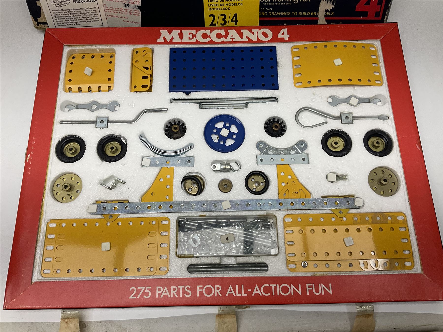 Meccano - Outfits 2, 3 & 4 with blue and yellow parts; look to be virtually complete with most apertures filled; together with a partially stocked Meccano Elekrikit; all boxed with instruction manuals (4)
