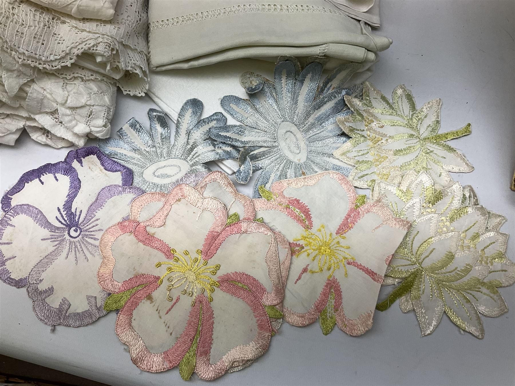 Large quantity of table linen and Victorian and later lace, framed machine tapestry depicting Greece, embroidered wall hanging decorated with a woodland scene with deer and blossoming tree, embroidered linen decorated with floral design, crochet, etc