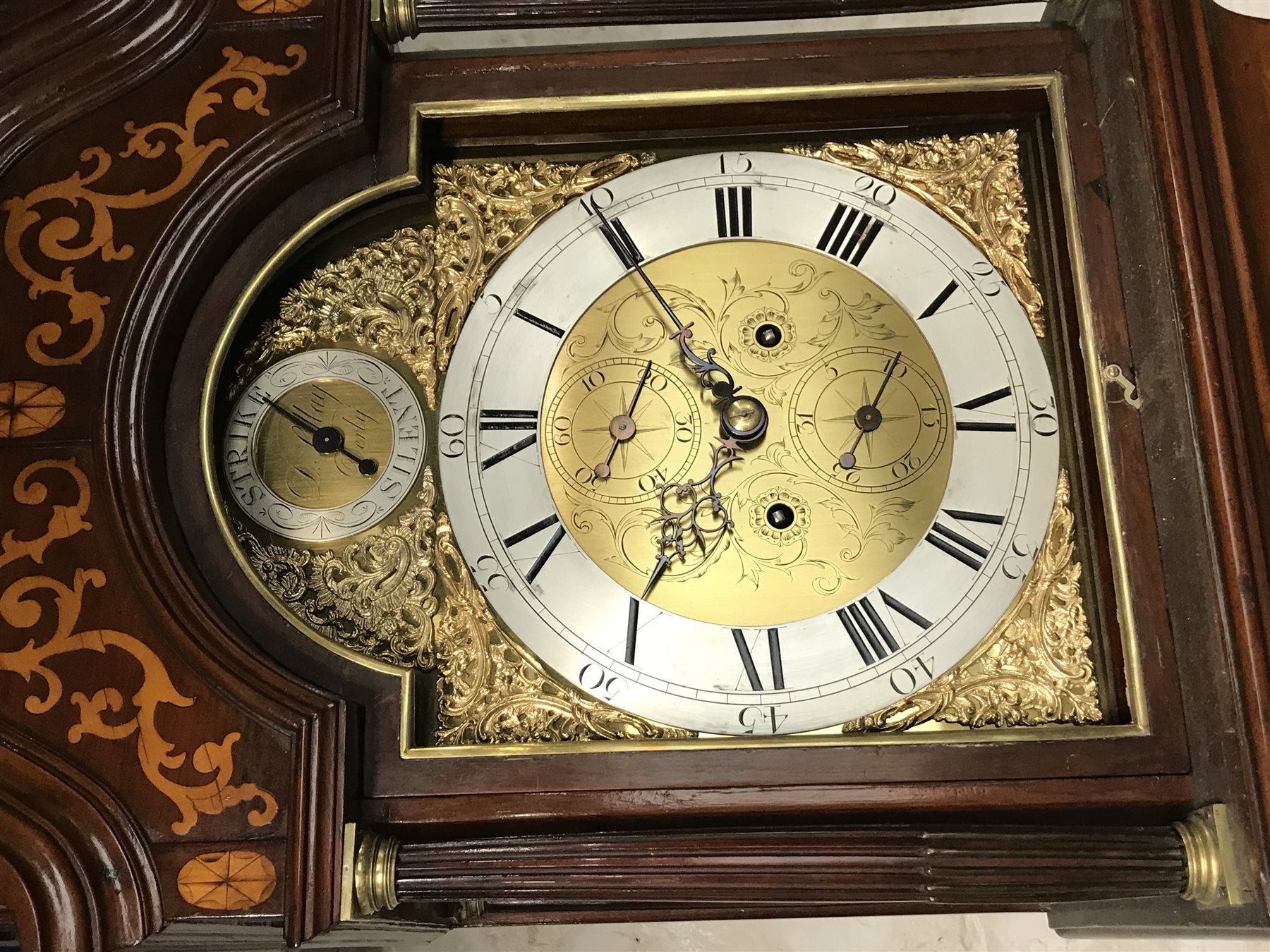 Early 19th century inlaid and cross banded mahogany London style longcase clock, brass arched dial, Roman and Arabic numerals, second and month subsidiary, lattice spandrel, eight day movement, automatic night time silent and strike mode, H242cm (two weights and pendulum)