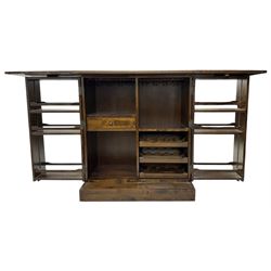 Laura Ashley - contemporary 'Garret' birch and dark chestnut finish bar cabinet, rectangular top with fold-out sides, double front doors enclosing shelving, wine racks, and glass storage, built-in stemware racks and bottle compartments, raised on plinth base