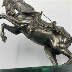 Modern silver model of a rearing horse, with ornate parcel gilt saddle and bridle, mounted upon a rectangular base, decorated with malachite panels to each side and upon four gilt bun feet, horse stamped 925, overall H14.5cm