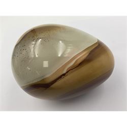 Polychrome jasper specimen egg, in creams, browns and earthy tones, upon a wooden stand, H12cm