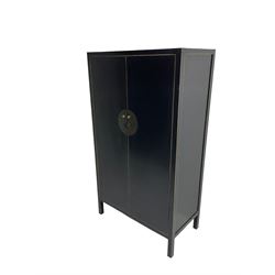 Chinese design black lacquered wardrobe, two cupboard doors enclosing hanging rail and two drawers