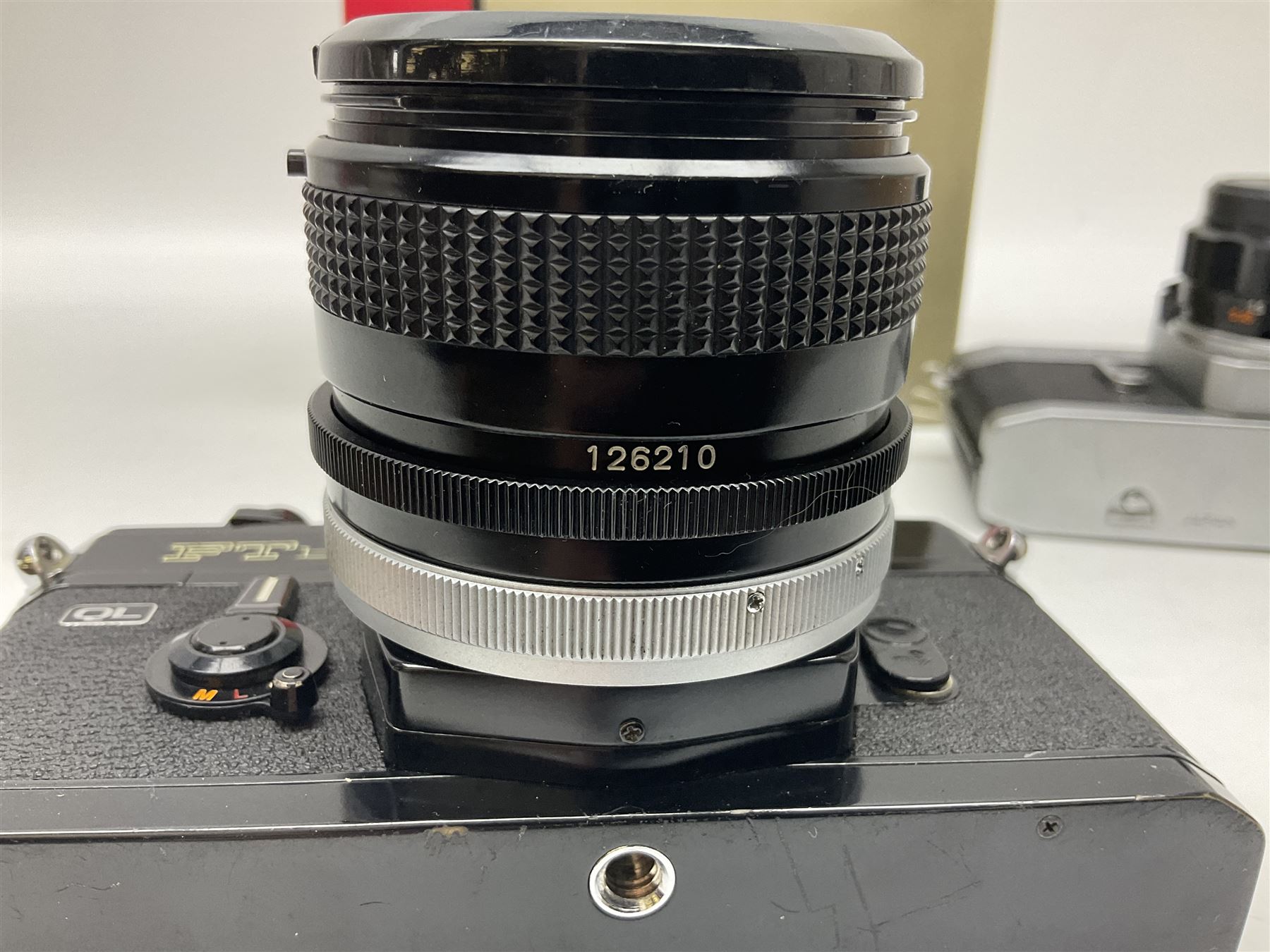 Canon FTb camera body, serial no. 715838, with 'Canon FD 50mm 1:1.8' lens, serial no. 207888, in original box, together with Canon FTb camera body, serial no. 557817, with 'Canon FD 35mm 1:3.5 S.C' lens, serial no. 126210 and Canon EX Auto camera body, serial no. 296244 with 'Canon EX 50mm 1:1.8' lens, serial no. 380869  