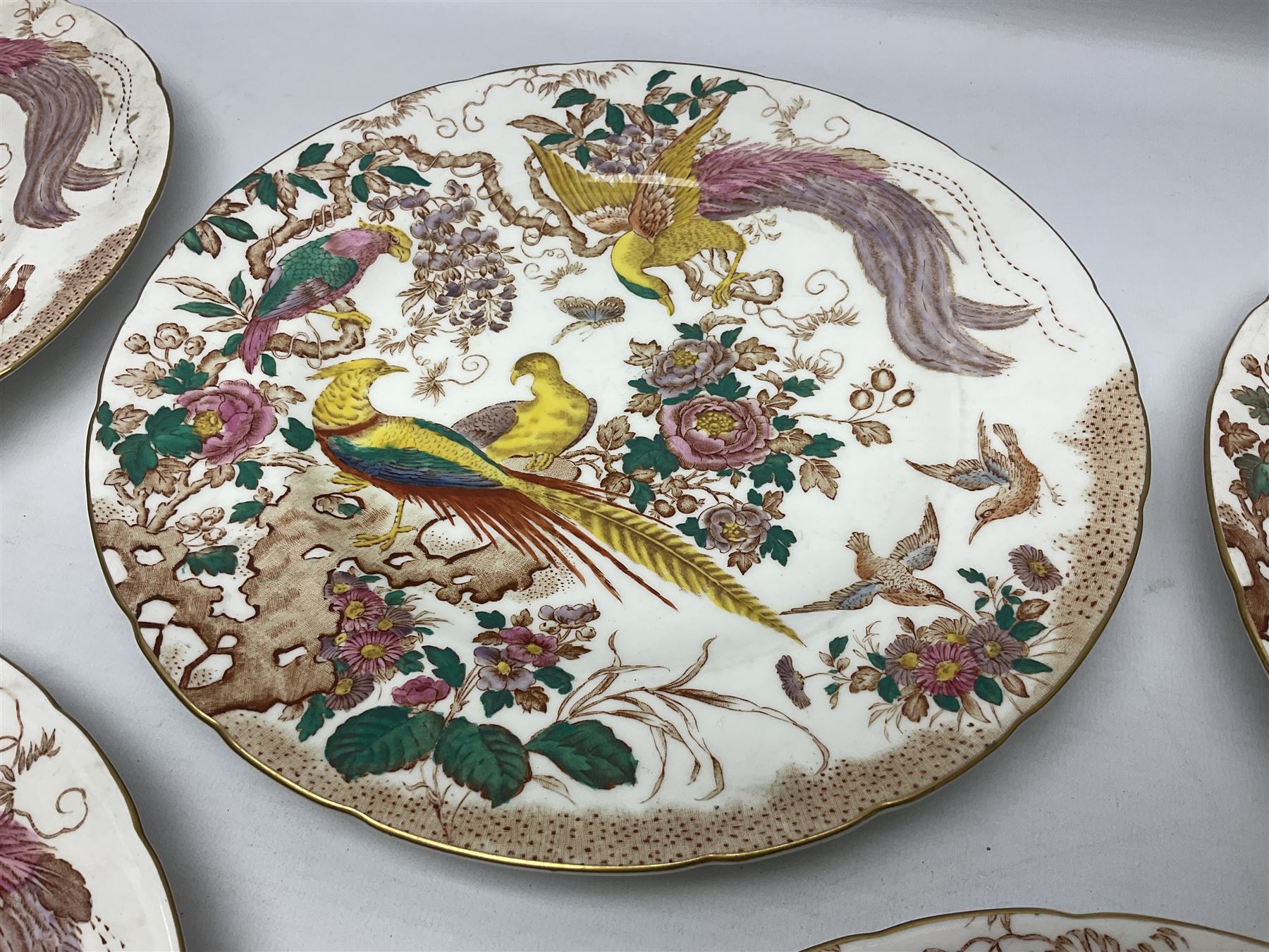 Five early 20th century Royal Crown Derby Olde Avesbury pattern dinner plates, decorated with oriental pheasants, butterflies and other birds amongst flowering branches, with impressed and printed marks to reverse, D26.5cm