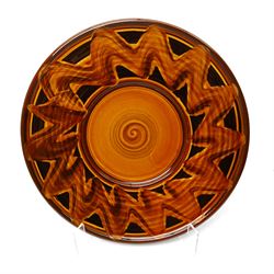 Clive Bowen (1943-): Large slipware charger, in black and orange glazes, unmarked D50cm