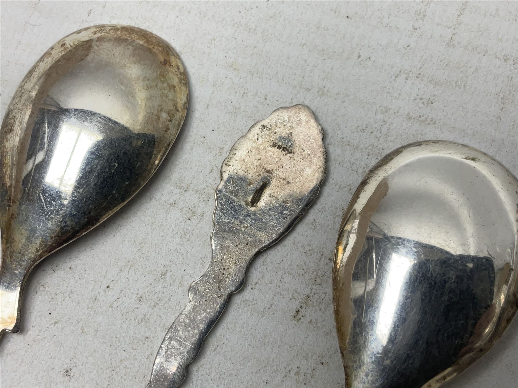 Set of four Continental silver spoons and forks, with stylised terminals, a number stamped S800, approximate weight 88.4 grams