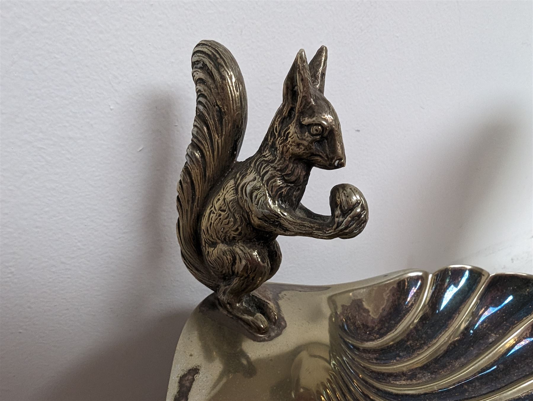 George Jensen stainless steel wine cooler, together with a silver plated pedestal dish, in the form of a clam shell and with squirrel decoration and four silver plated trinket dishes with applied pheasant decoration