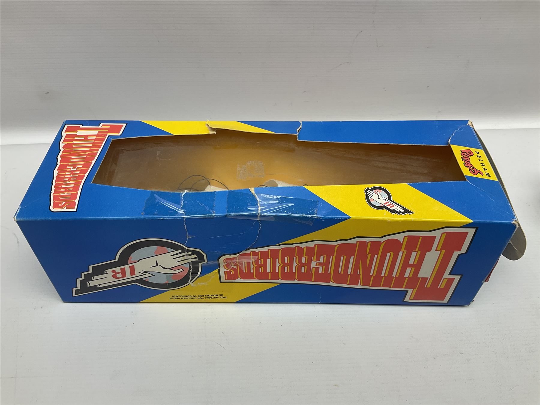 Three Pelham puppets - 'Brains' from Thunderbirds in blue/yellow box; Witch in yellow window box; and Macboozle in brown box (3)