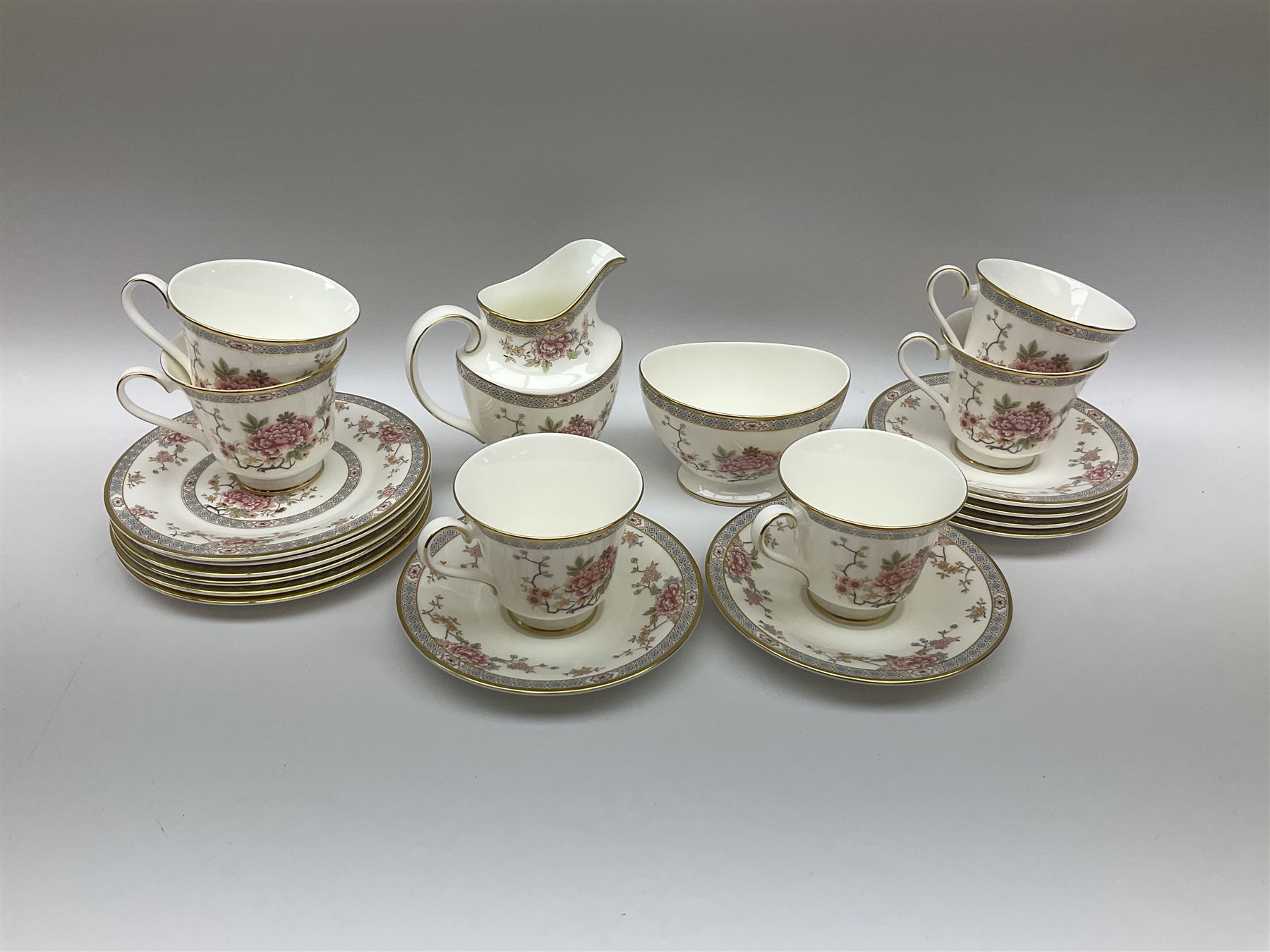 Wedgwood Queens Ware tea and dinner wares in Provence pattern, including ten cups and saucers, milk jug, butter dish with cover, ten dinner plates, ten bowls and ten side plates etc (71), together with Royal Doulton tea wares in Canton pattern, comprising six cups and saucers, milk jug, open sucrier and six dessert plates.    