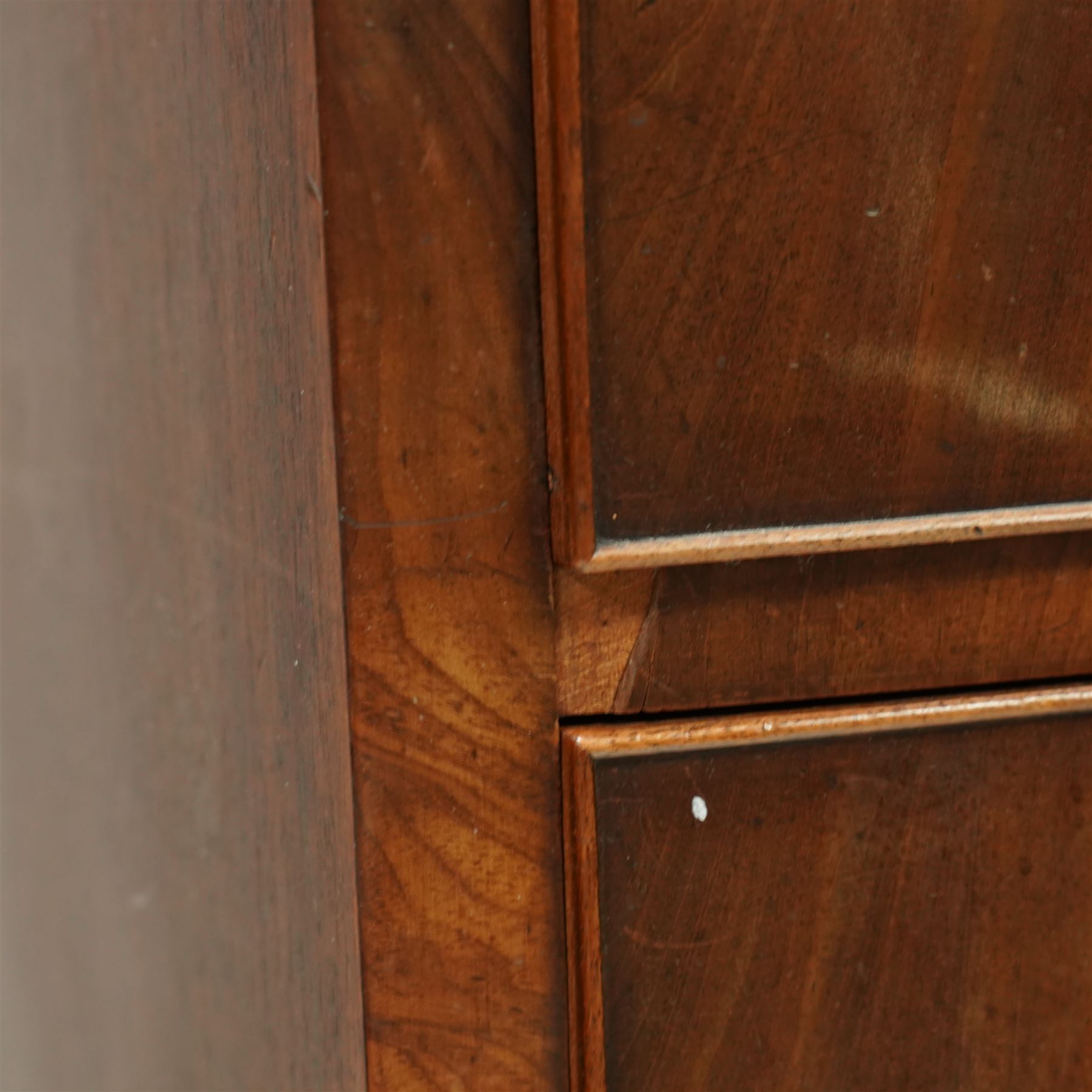 19th century mahogany chest of drawers, bow fronted form with two short over three long drawers, each veneered in matched flame mahogany, on turned feet