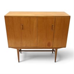 Alfred Cox - mid-20th century teak cabinet, rectangular top over two bifold doors with ins...