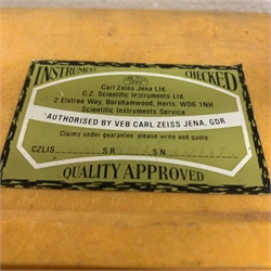 Carl Zeiss Theo 015B orange painted theodolite serial no.251267 in fitted case with accessories; E.R. Watts & Sons London level with black crackled body, serial no.1888, in calf leather carrying case; wooden folding tripod and telescopic measuring staff (4)