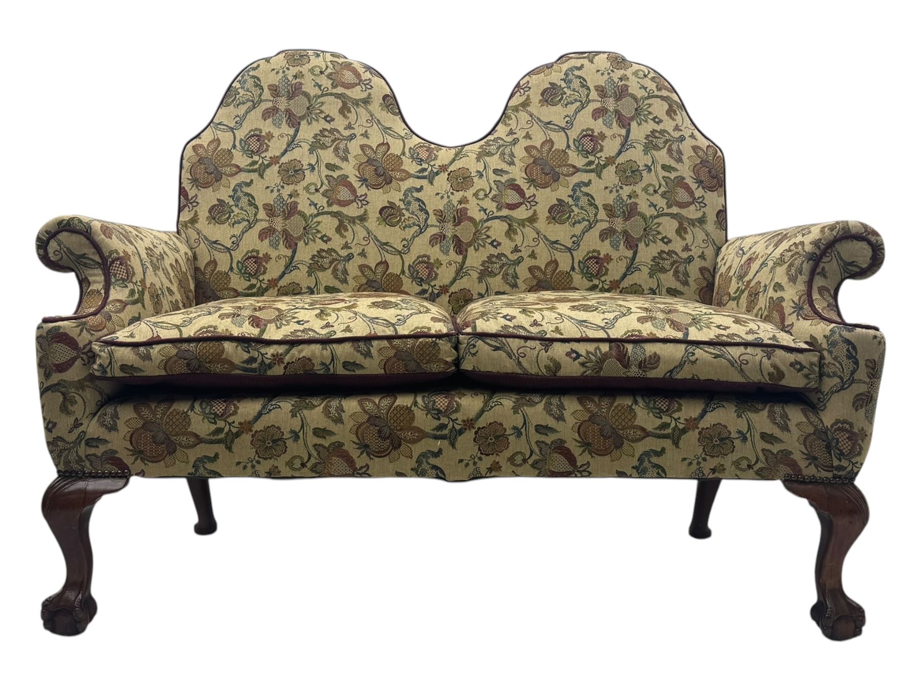 Mid-20th century William and Mary design two-seat sofa, upholstered in floral patterned fabric with contrasting piping, featuring camel-shaped back and scroll arms, on cabriole supports