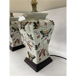 Pair of table lamps of square baluster form, decorated in a butterfly motif, upon a square base, including shade H55cm