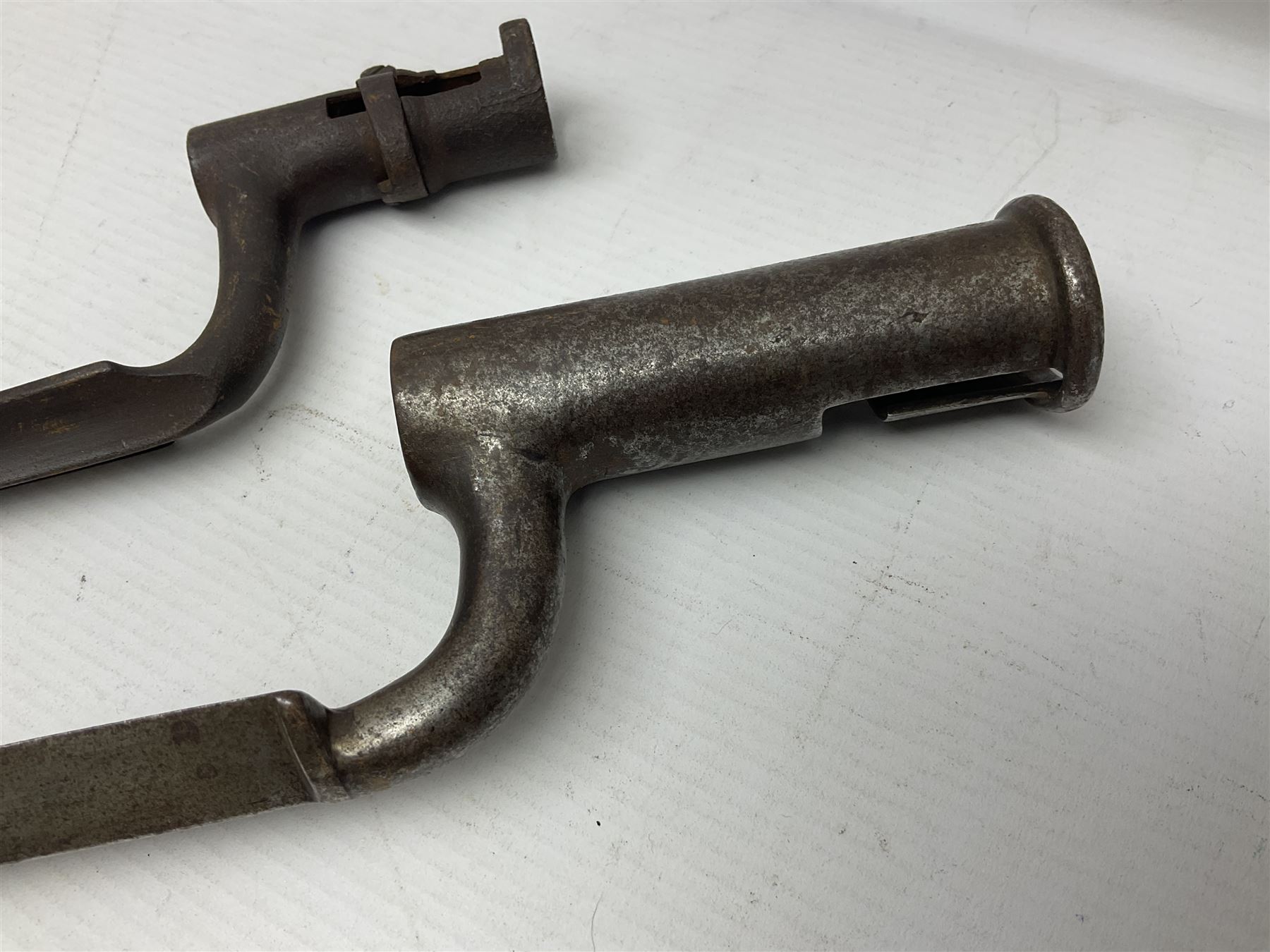 Early 19th century British Brown Bess musket rifle socket bayonet with zigzag fitting stamped D71 and triangular blade stamped 270 L55cm overall; and two other 19th century socket bayonets; no scabbards (3)