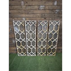 Four 19th century cast iron windows, lattice glazed in white painted finish, 