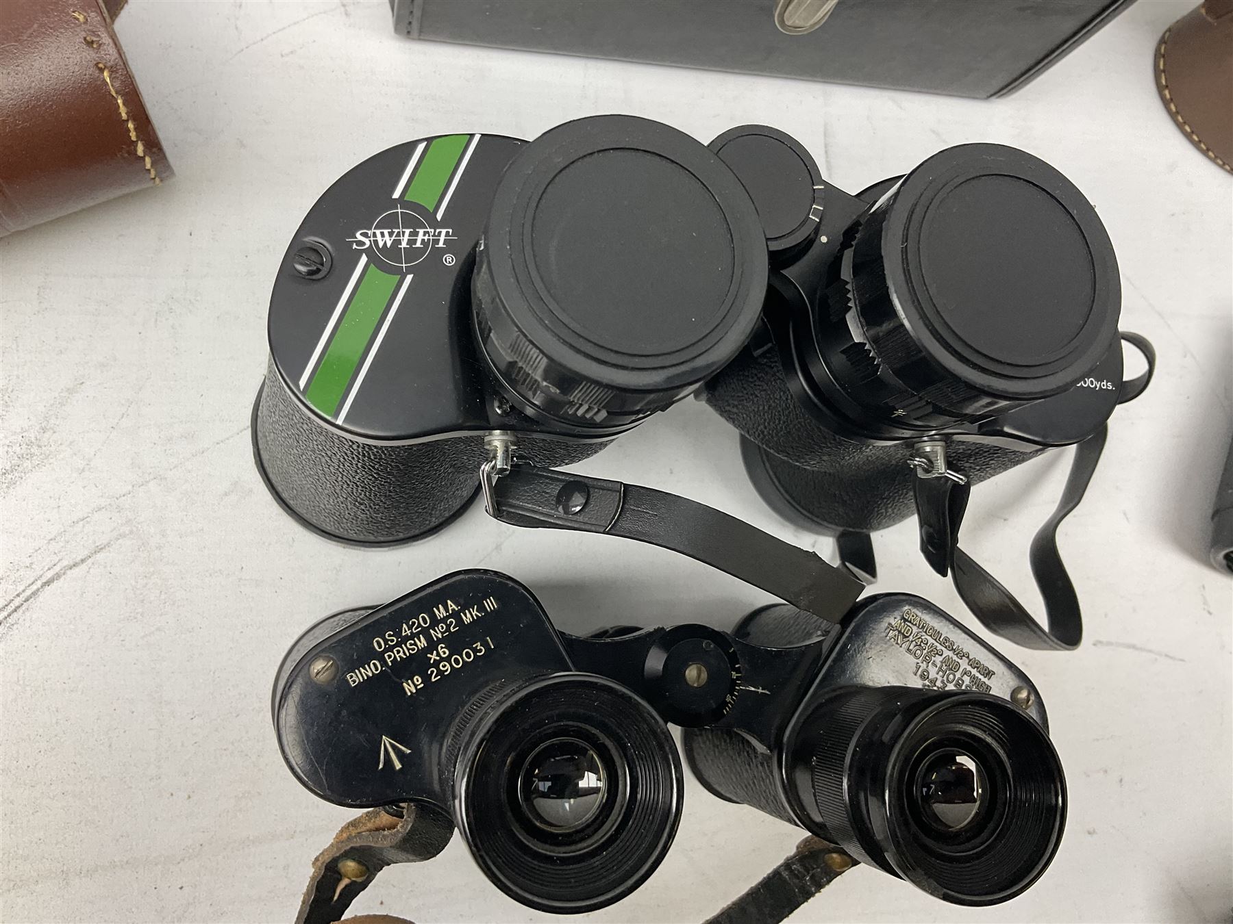 Eleven pairs of binoculars, to include Zeiss Wetzler 20x50, Taylor-Hobson Bino Prism No.2 Mk.III military stamped 1943 with broad arrow,  Swift Tecnar 16x50, J.T Coppock Oceanic Bloomed 10x50, Hensoldt Wetzlar Dialyt 7x42 etc