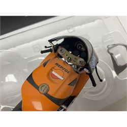 Three Ixo Models 1:12 scale die-cast models of motorcycles - BRB007 Honda NSR500 Michael Doohan 1998; BRB001 Honda RC211V Valentino Rossi 2003; and Yamaha YZR-M1 Colin Edwards MotoGP Phillip Island 2007; all boxed (3)