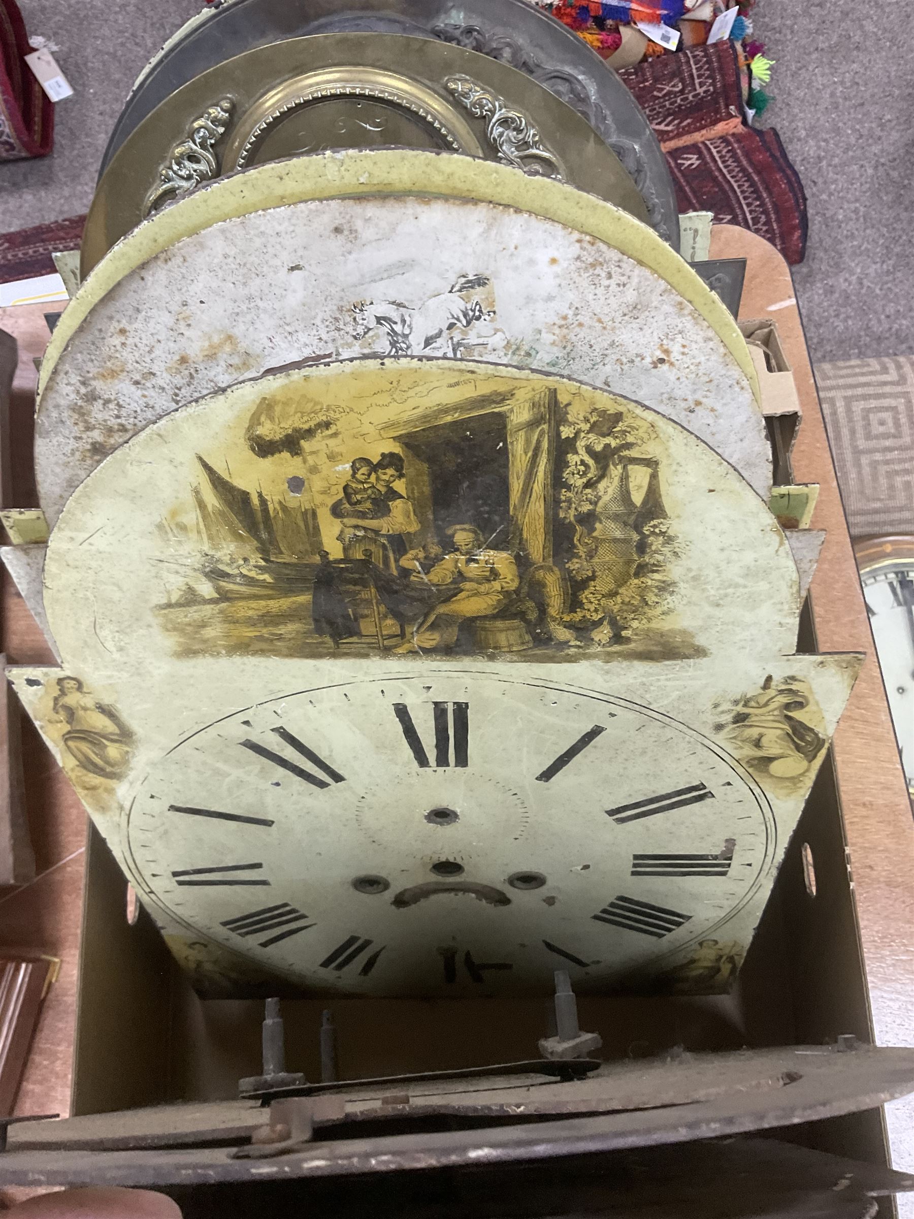 Approximately thirteen longcase clock faces, mainly 18th and 19th century, including brass and painted dials