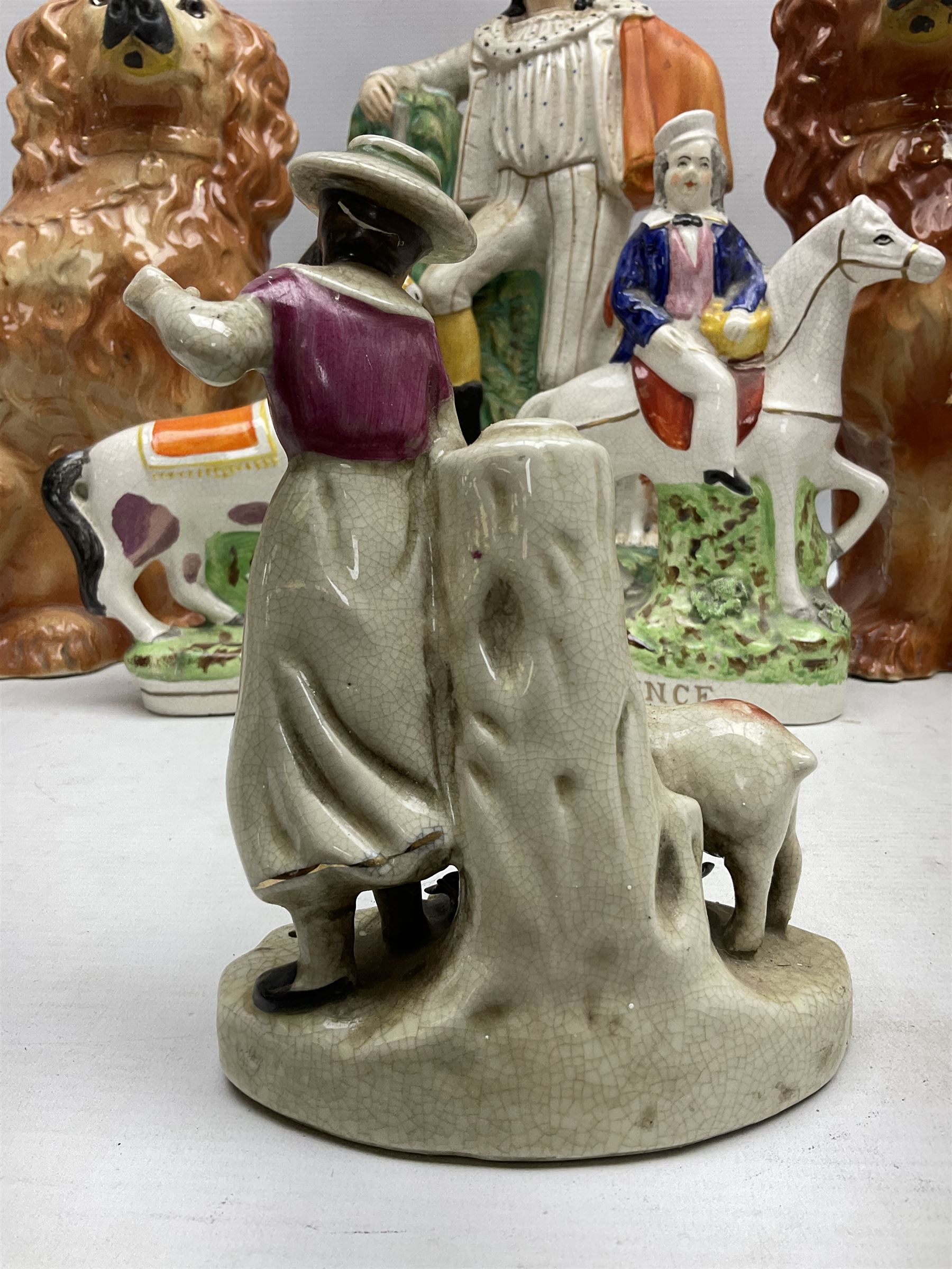 Group of Victorian and later Staffordshire style figures, to include two dogs, Prince upon horse back, horse with pink lustre patches, tall figure of a man beside his dog etc, tallest H41cm