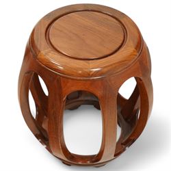 20th century Chinese hardwood drum-shaped stool or side table, circular top above shaped apron raised on eight curved scroll-decorated supports