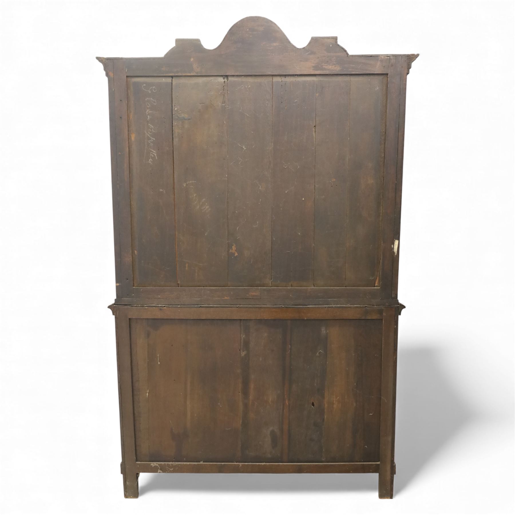 Late 19th century Continental bombe cabinet on chest, shaped moulded cornice with carved cresting, the upper section enclosed by a pair of arched glazed doors with astragal glazing revealing a shelved interior, the lower section fitted with four graduating drawers with rococo-style metal handles, serpentine front and sides, raised on scroll and paw feet