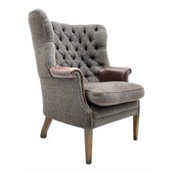 Harris Tweed - 'Mackenzie' barrel wingback armchair, upholstered in deeply buttoned grey Herringbone wool fabric, scrolled arm with studded detail and upholstered in contrasting brown leather, brown leather piping, square tapering front supports
