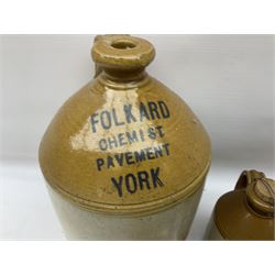 Large stoneware two tone flagon with black lettering Folkard Chemist Pavement York, together with two stoneware jugs, Bronte Yorkshire Liqueur and Creedy Vintage Cider, and salt glaze example, together with four vintage glass bottles, tallest H33cm