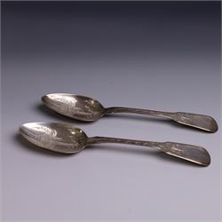 Pair of George III silver Fiddle pattern table spoons, each with bright cut floral and fol...