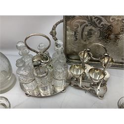 Collection of silver plate, to include egg cruet, twin handled tray with pierced decoration, cruet set, etc together with a selection of glassware to include decanters, tankards etc 