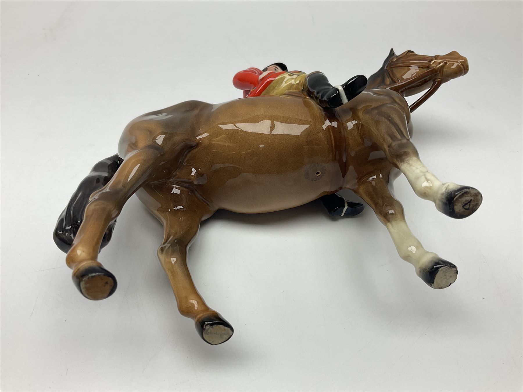 Beswick huntsman upon a bay horse no. 1501, with printed mark beneath, H22cm