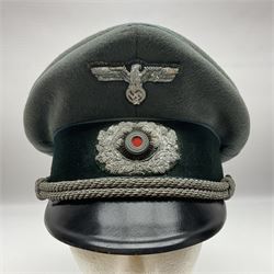 WW2 German Infantry Officer's visor cap with cloth insignia; labelled and stamped Offizier Kleiderkasse Berlin and Erel Stirnschutz