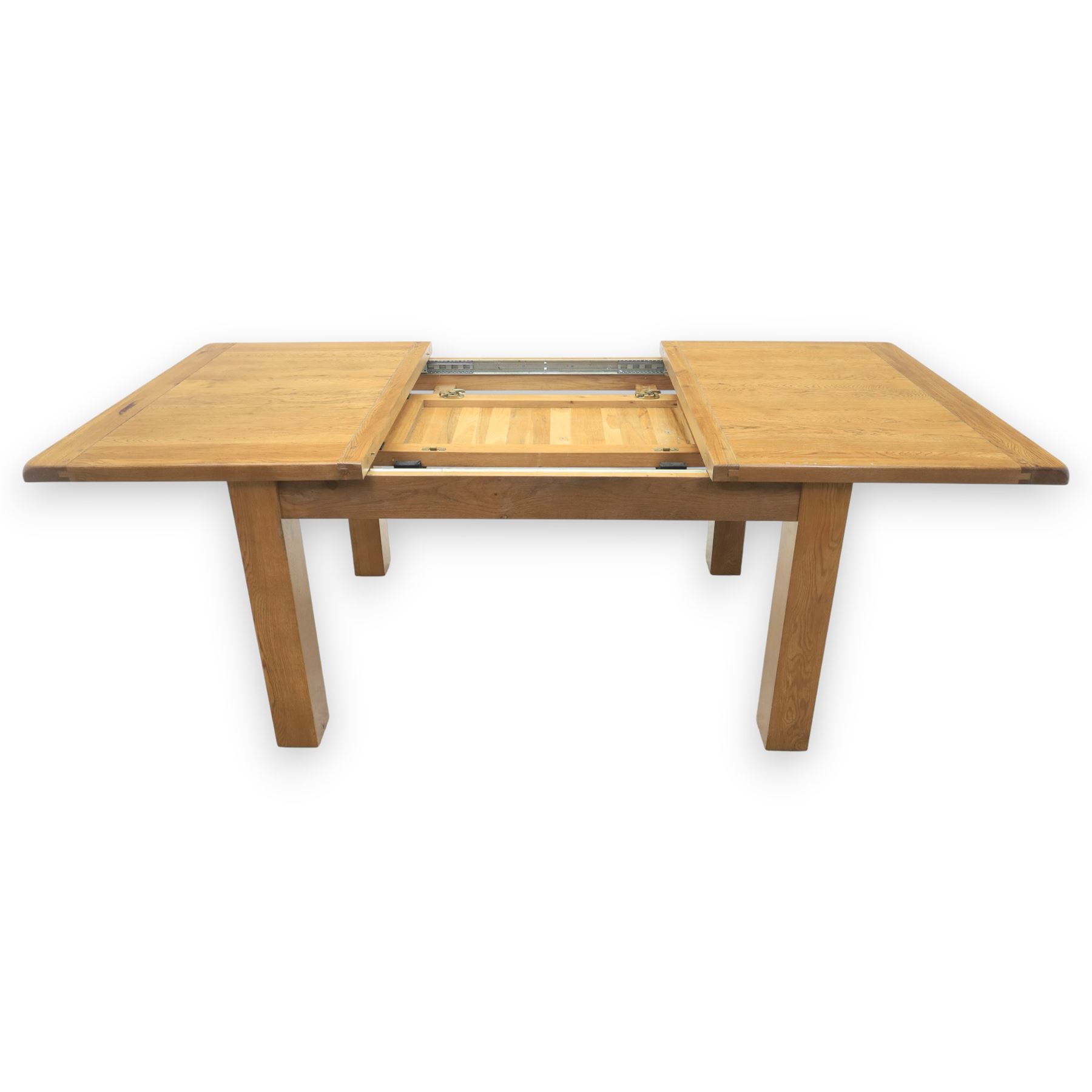 Contemporary oak extending dining table, moulded rectangular top with visible grain and inset extension leaf, pull out extending mechanism, standing on four square legs, accompanied by a set of high slat back chairs with upholstered brown faux leather seats and square tapering supports joined by stretchers