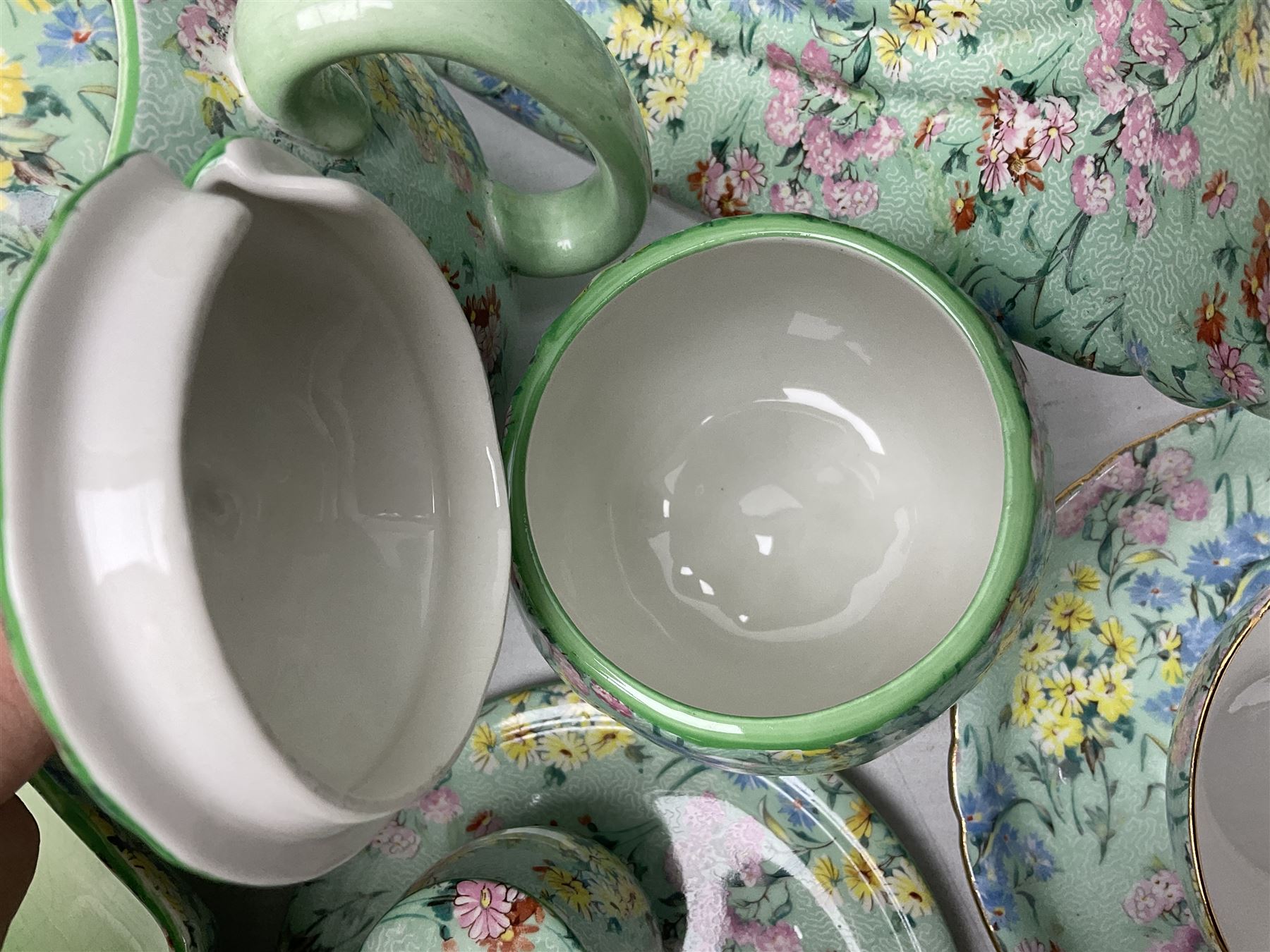 Shelley Melody pattern tea service for six, to include teapot, teapot stand, hot water jug, milk jug, covered sucrier, teacups and saucers, cake plates etc (31)