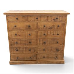 Indigo Furniture - large rustic oak combination chest, three drawers above ten drawers, wi...