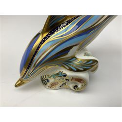Four Royal Crown Derby paperweights, Llama, with gold stopper, Snake, with gold stopper, Honeybear, with silver stopper and Striped Dolphin, with gold stopper and box, all with printed mark beneath 