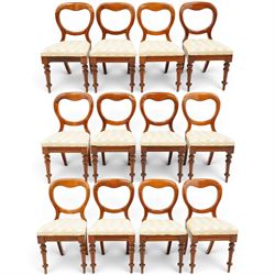 Set of twelve Victorian walnut balloon-back dining chairs, shaped open back over seats uph...