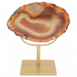 Pair of red agate slices, polished with rough edges raised upon gilt metal stands, H20cm