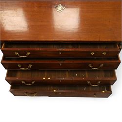 George III mahogany bureau of large proportions, the fall-front enclosing fitted interior with fluted column secret compartments and assorted pigeonholes and correspondence drawers flanking central cupboard, over four graduating cock-beaded drawers with original brass swan-neck handles, raised on bracket feet