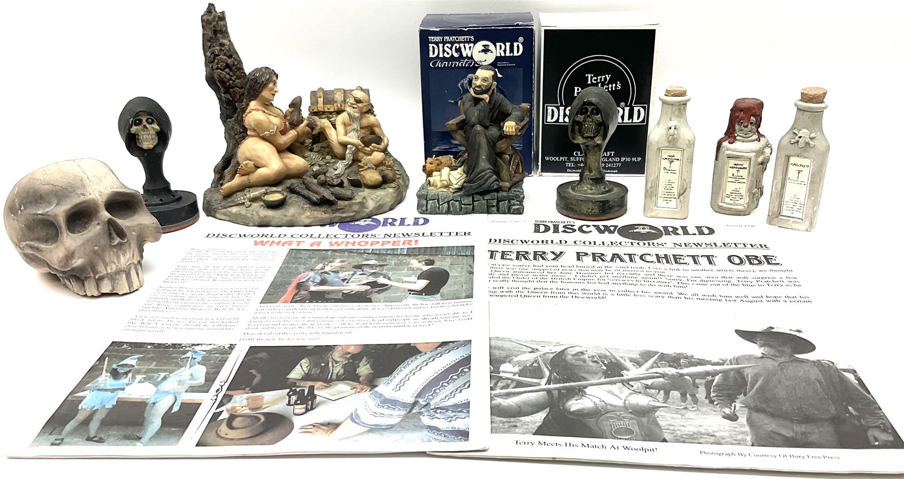 Terry Pratchett Discworld figures, designed by Clarecraft, comprising Cohen the barbarian, DW42, the Patrician, boxed, DW37, three Potions, DW18, DW19, DW20, two Death Bookstamps, DW50, the Gods Dice Box, boxed, DW26, together with two Discworld newsletters, volume 5, August 1998 and volume 6, August 1999. 