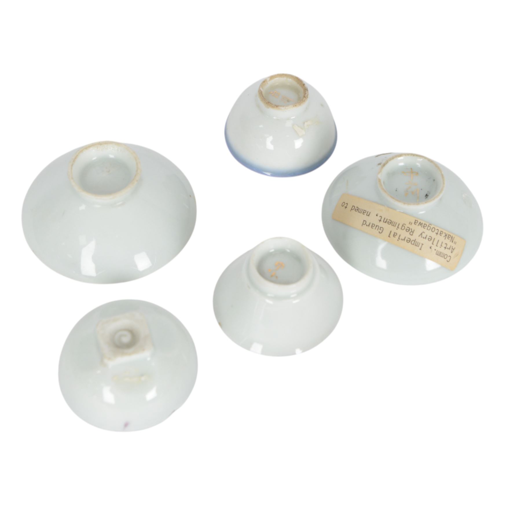 Five red lacquered saki bowls, together with five porcelain examples, red lacquered D9cm