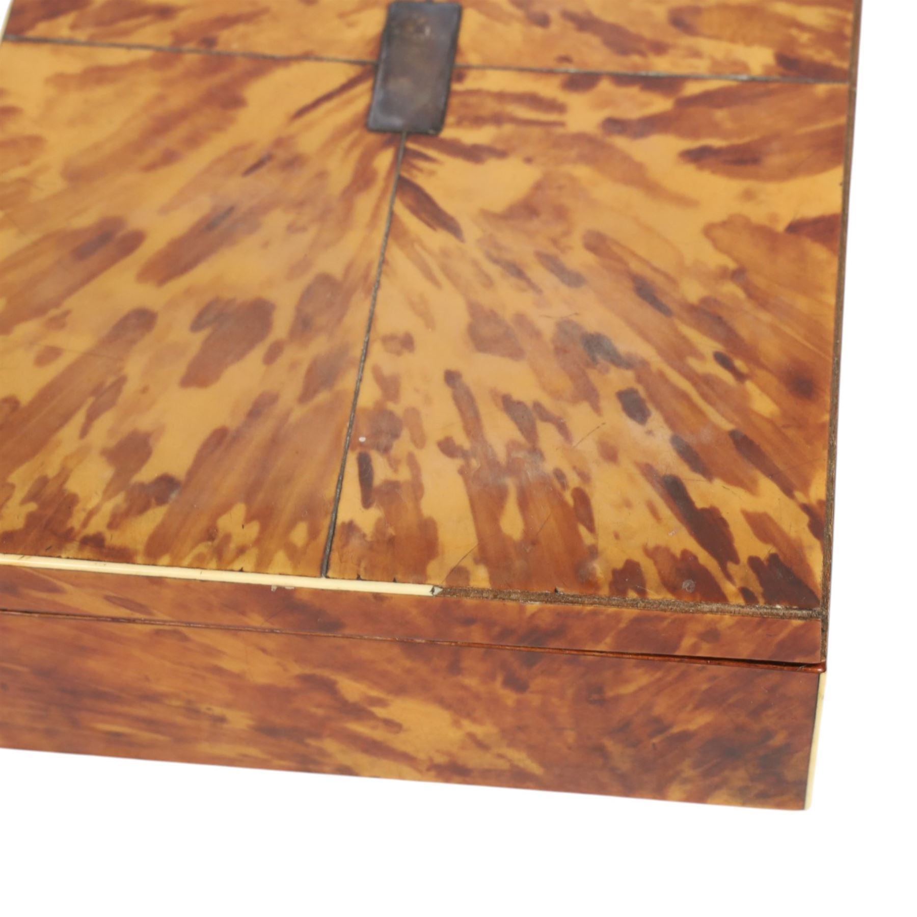 Regency blond tortoiseshell veneered box, the hinged lid with inlaid white metal and central cartouche, H7cm, L26cm