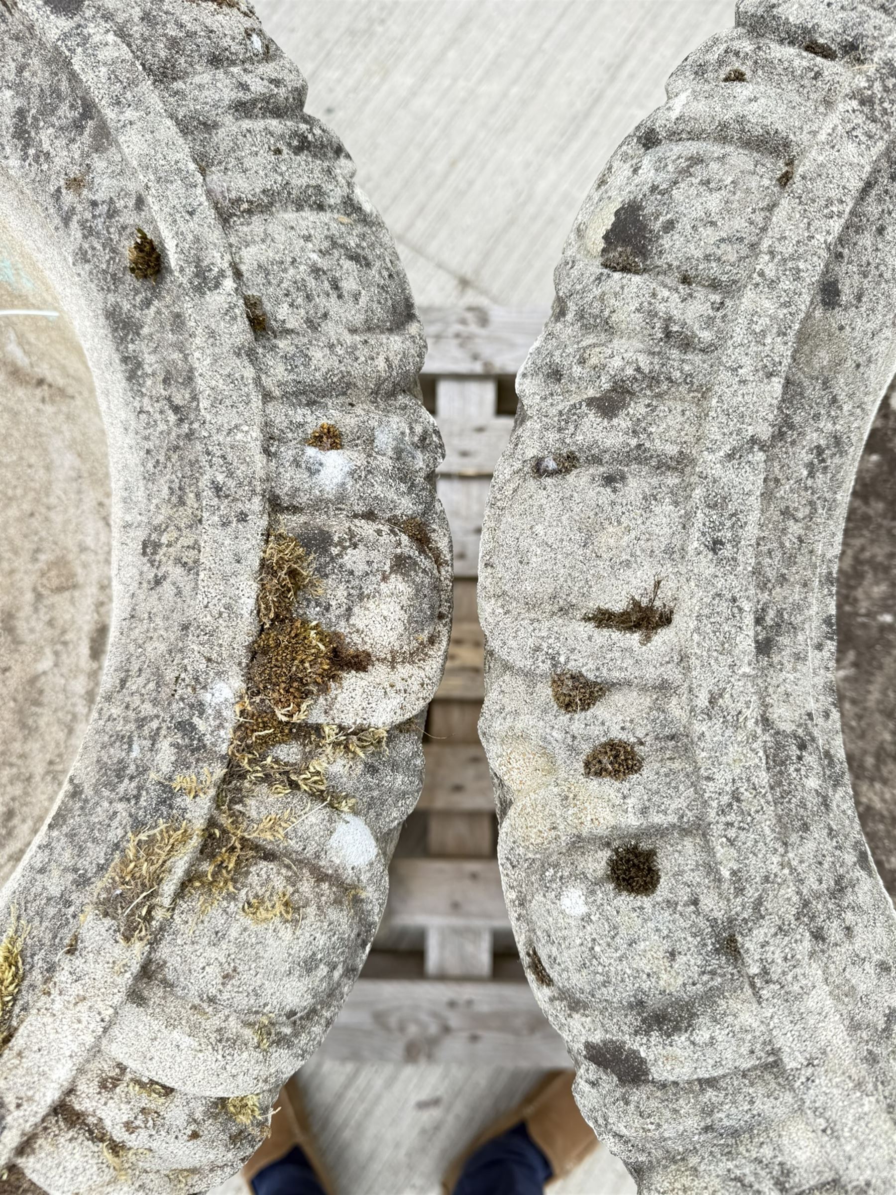 Pair of large weathered Country House Haddonstone garden urns, acanthus carved rim above gadrooned bowl, beaded detailing to the neck, raised on stepped double plinth base
