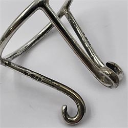 Modern silver limited edition Easter egg, no. 70/500, the openwork lattice body decorated with gilded panels of flower heads, opening to reveal a gilt interior, upon silver stand with three scrolling pad feet, each hallmarked St James House Company, London 1979, height including stand 8cm