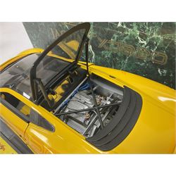 Two Maisto 1:12 scale Jaguar XJ220 ‘Racing’ cars in yellow, both on plinths in original boxes 